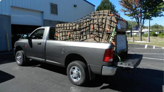 Cargo netting holding down a load on a truck