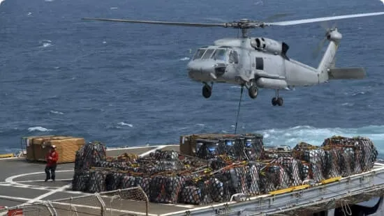 Helicopter using lifting nets to haul cargo